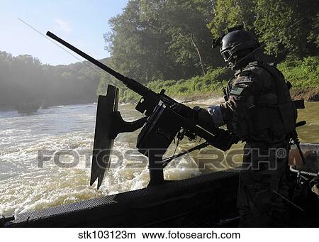 A Special Warfare Combatant-craft Crewman manning an M240N. 762mm machine gun at Fort Knox. View Large Photo Image Picture - A Special Warfare Combatant-craft Crewman manning an M240N. 762mm machine gun at Fort Knox. . Fotosearch