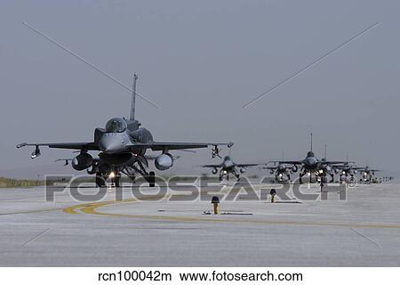 A squadron of Turkish Air Force F-16 Block 50+ aircraft taxiing on the runway. View Large Photo Image Picture - A squadron of Turkish Air Force F-16 Block 50+ aircraft taxiing on the runway.. Fotosearch