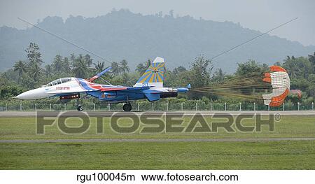A Sukhoi Su-27 Flanker of the Russian Knights with parachute deployed. View Large Photo Image Picture - A Sukhoi Su-27 Flanker of the Russian Knights with parachute deployed.. Fotosearch