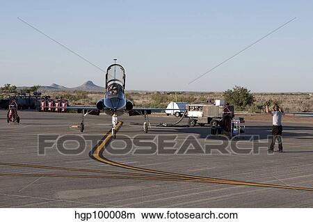 A T-38 pilot prepares to taxi his aircraft for a training mission. View Large Photo Image Picture - A T-38 pilot prepares to taxi his aircraft for a training mission.. Fotosearch