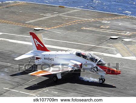 A T-45C Goshawk lands on the flight deck of USS Ronald Reagan. View Large Photo Image Picture - A T-45C Goshawk lands on the flight deck of USS Ronald Reagan.. Fotosearch