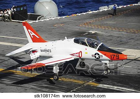 A T-45C Goshawk lands on the flight deck of USS Theodore Roosevelt. View Large Photo Image Picture - A T-45C Goshawk lands on the flight deck of USS Theodore Roosevelt.. Fotosearch
