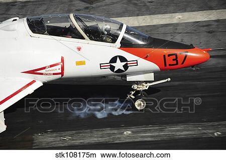A T-45C Goshawk lands on the flight deck of USS Theodore Roosevelt. View Large Photo Image Picture - A T-45C Goshawk lands on the flight deck of USS Theodore Roosevelt.. Fotosearch
