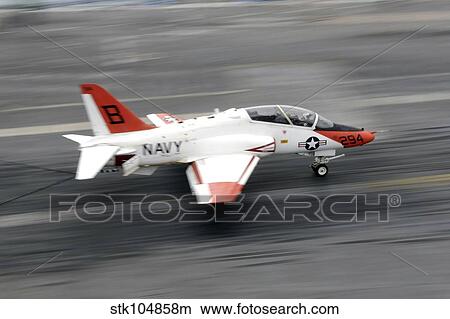 A T-45C Goshawk training aircraft makes an arrested landing. View Large Photo Image Picture - A T-45C Goshawk training aircraft makes an arrested landing.. Fotosearch