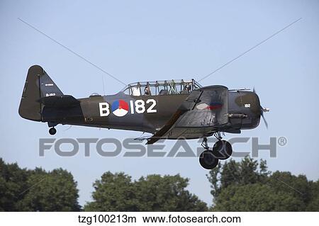 A T-6 Harvard Trainer of the Dutch Air Force historic flight team. View Large Photo Image Picture - A T-6 Harvard Trainer of the Dutch Air Force historic flight team.. Fotosearch
