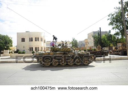 Picture - A T-72 main battle tank on the streets of Azaz, Syria.. Fotosearch