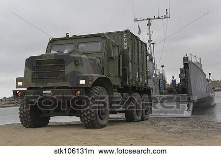 Picture - A tactical vehicle is off-loaded from a landing craft utility.. Fotosearch