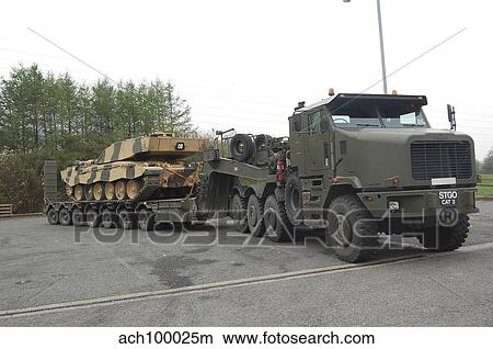 A tank transporter hauling a Challenger 2 main battle tank to Wales for an exercise. View Large Photo Image Picture - A tank transporter hauling a Challenger 2 main battle tank to Wales for an exercise.. Fotosearch