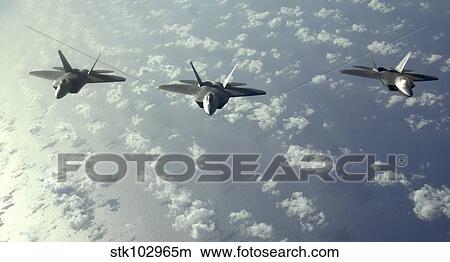 A three-ship formation of F-22 Raptors fly over the Pacific Ocean. View Large Photo Image Picture - A three-ship formation of F-22 Raptors fly over the Pacific Ocean.. Fotosearch