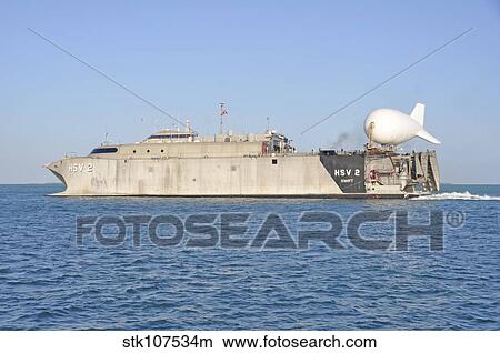 Picture - A TIF-25K aerostat tethered on the stern of high-speed vessel Swift.. Fotosearch