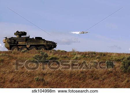 A TOW missile is launched from an armored vehicle. View Large Photo Image Picture - A TOW missile is launched from an armored vehicle.. Fotosearch