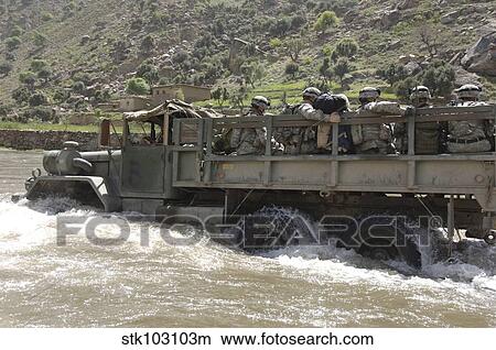A truck full of U. S. Army soldiers fording the Pech River in Pech Valley, Afghanistan. View Large Photo Image Picture - A truck full of U. S. Army soldiers fording the Pech River in Pech Valley, Afghanistan.. Fotosearch