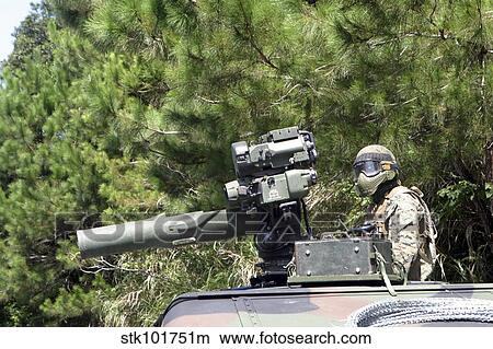 A tube-launched, optically-tracked, wire-guided missile gunner scans for threats. View Large Photo Image Picture - A tube-launched, optically-tracked, wire-guided missile gunner scans for threats.. Fotosearch