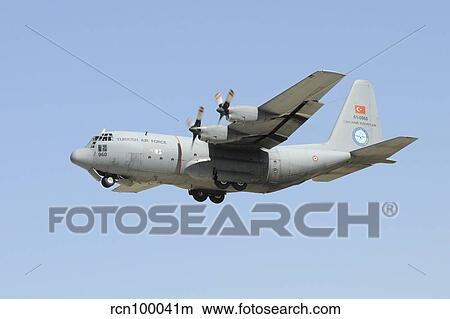 A Turkish Air Force C-130 in flight over Konya, Turkey. View Large Photo Image Picture - A Turkish Air Force C-130 in flight over Konya, Turkey.. Fotosearch