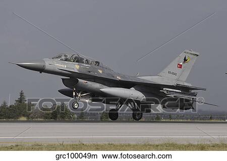 A Turkish Air Force F-16D landing on the runway at Konya Air Base. View Large Photo Image Picture - A Turkish Air Force F-16D landing on the runway at Konya Air Base.. Fotosearch