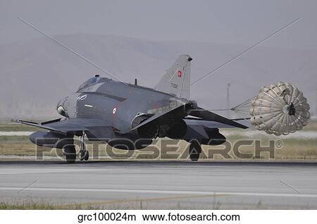 A Turkish Air Force F-4E 2020 Terminator deploys its drag chute upon landing. View Large Photo Image Picture - A Turkish Air Force F-4E 2020 Terminator deploys its drag chute upon landing.. Fotosearch