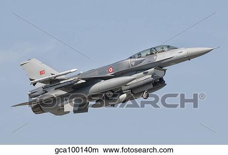 A Turkish-built F-16 in flight at the Izmir Air Show in Turkey. View Large Photo Image Picture - A Turkish-built F-16 in flight at the Izmir Air Show in Turkey.. Fotosearch