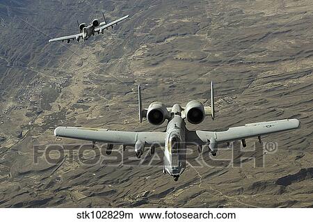 A two-ship A-10 Thunderbolt II formation flies a combat mission over Afghanistan. View Large Photo Image Picture - A two-ship A-10 Thunderbolt II formation flies a combat mission over Afghanistan.. Fotosearch