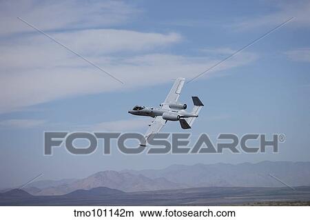 A U. S. Air Force A-10 Thunderbolt II in flight over New Mexico. View Large Photo Image Picture - A U. S. Air Force A-10 Thunderbolt II in flight over New Mexico.. Fotosearch