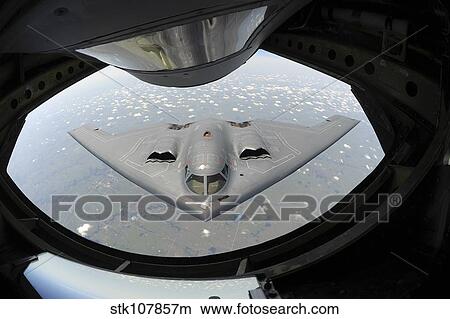 A U. S. Air Force B-2 Spirit approaches a KC-135 Stratotanker. View Large Photo Image Picture - A U. S. Air Force B-2 Spirit approaches a KC-135 Stratotanker.. Fotosearch