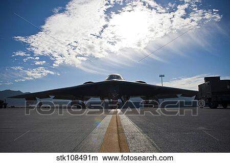 A U. S. Air Force B-2 Spirit is inspected by ground crews. View Large Photo Image Picture - A U. S. Air Force B-2 Spirit is inspected by ground crews.. Fotosearch
