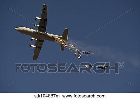 Picture - A U. S. Air Force C-130 Hercules airdrops 20 bundles over Afghanistan.. Fotosearch