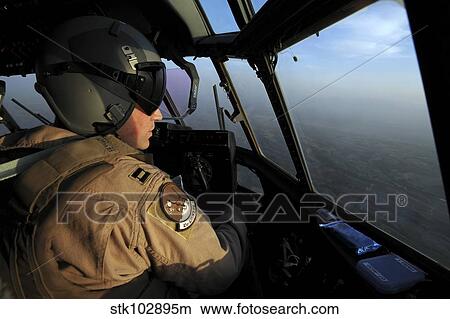 A U. S. Air Force C-130J Hercules pilot flies a mission over Afghanistan. View Large Photo Image Picture - A U. S. Air Force C-130J Hercules pilot flies a mission over Afghanistan.. Fotosearch
