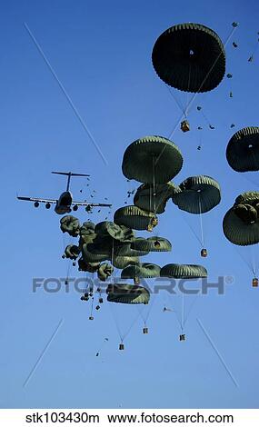 Picture - A U. S. Air Force C-17 Globemaster III aircraft airdrops humanitarian aid into Port-au-Prince, Haiti.. Fotosearch