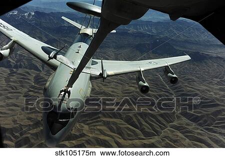 A U. S. Air Force E-3 Sentry aircraft refueling from a KC-10 Extender. View Large Photo Image Picture - A U. S. Air Force E-3 Sentry aircraft refueling from a KC-10 Extender.. Fotosearch