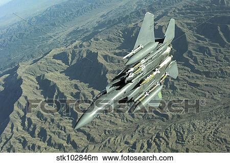 A U. S. Air Force F-15E Strike Eagle on a combat patrol over Afghanistan. View Large Photo Image Picture - A U. S. Air Force F-15E Strike Eagle on a combat patrol over Afghanistan. . Fotosearch