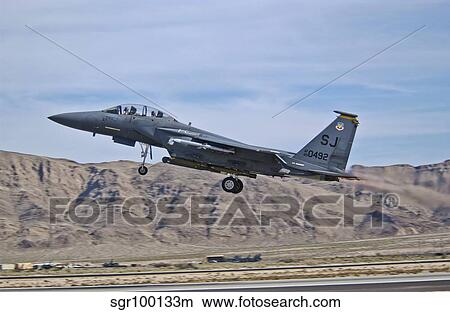 A U. S. Air Force F-15E Strike Eagle taking off from Nellis Air Force Base. View Large Photo Image Picture - A U. S. Air Force F-15E Strike Eagle taking off from Nellis Air Force Base.. Fotosearch