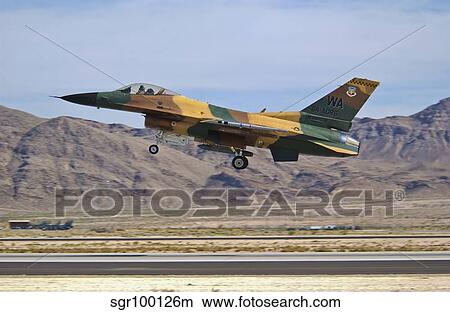 A U. S. Air Force F-16 taking off from Nellis Air Force Base. View Large Photo Image Picture - A U. S. Air Force F-16 taking off from Nellis Air Force Base.. Fotosearch