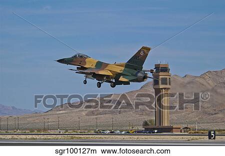 A U. S. Air Force F-16 taking off from Nellis Air Force Base. View Large Photo Image Picture - A U. S. Air Force F-16 taking off from Nellis Air Force Base.. Fotosearch
