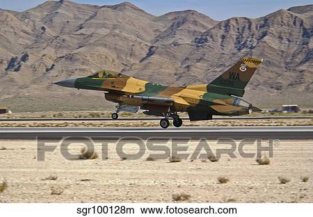 A U. S. Air Force F-16 taking off from Nellis Air Force Base. View Large Photo Image Picture - A U. S. Air Force F-16 taking off from Nellis Air Force Base.. Fotosearch