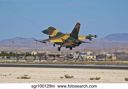 A U. S. Air Force F-16 taking off from Nellis Air Force Base. View Large Photo Image Picture - A U. S. Air Force F-16 taking off from Nellis Air Force Base.. Fotosearch