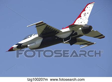 A U. S. Air Force F-16 Thunderbird jet in flight over Belgium. View Large Photo Image Picture - A U. S. Air Force F-16 Thunderbird jet in flight over Belgium.. Fotosearch