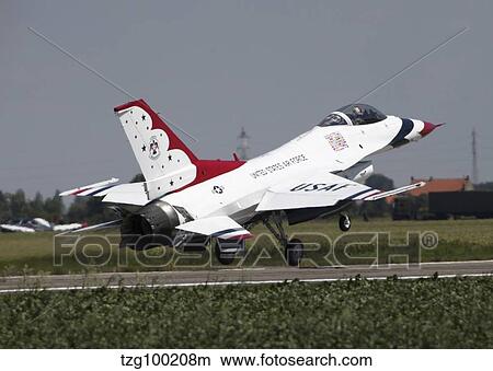 A U. S. Air Force F-16 Thunderbird jet taking off. View Large Photo Image Picture - A U. S. Air Force F-16 Thunderbird jet taking off.. Fotosearch