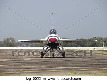 A U. S. Air Force F-16 Thunderbird jet taxiing on the flight line. View Large Photo Image Picture - A U. S. Air Force F-16 Thunderbird jet taxiing on the flight line.. Fotosearch