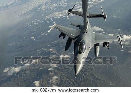 A U. S. Air Force F-16C Fighting Falcon conducts aerial refueling. View Large Photo Image Picture - A U. S. Air Force F-16C Fighting Falcon conducts aerial refueling.. Fotosearch
