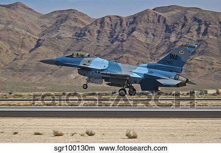 A U. S. Air Force F-16C taking off from Nellis Air Force Base. View Large Photo Image Picture - A U. S. Air Force F-16C taking off from Nellis Air Force Base.. Fotosearch
