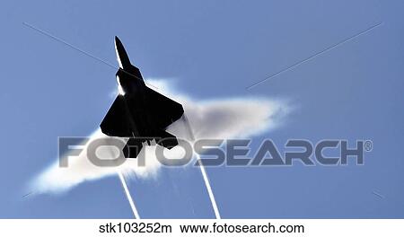 A U. S. Air Force F-22 Raptor aircraft executing a supersonic flyby. View Large Photo Image Picture - A U. S. Air Force F-22 Raptor aircraft executing a supersonic flyby.. Fotosearch