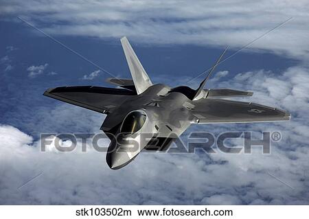 Picture - A U. S. Air Force F-22 Raptor aircraft flies near Guam.. Fotosearch