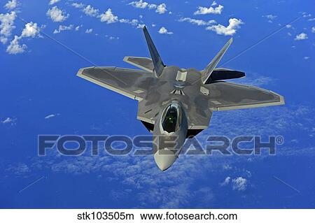 A U. S. Air Force F-22 Raptor in flight near Guam. View Large Photo Image Picture - A U. S. Air Force F-22 Raptor in flight near Guam.. Fotosearch