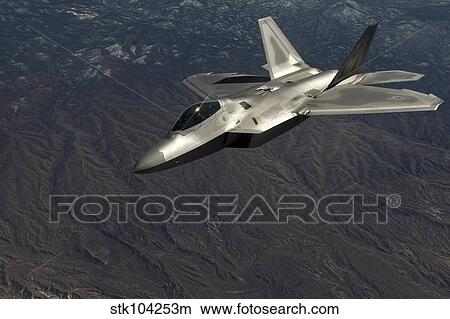 A U. S. Air Force F-22 Raptor in flight. View Large Photo Image Picture - A U. S. Air Force F-22 Raptor in flight.. Fotosearch