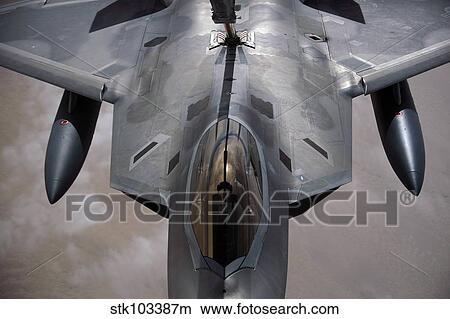 A U. S. Air Force F-22 Raptor is refueled by a KC-10A Extender. View Large Photo Image Picture - A U. S. Air Force F-22 Raptor is refueled by a KC-10A Extender.. Fotosearch