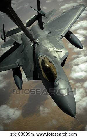 A U. S. Air Force F-22 Raptor is refueled by a KC-10A Extender aircraft over southwest Asia. View Large Photo Image Picture - A U. S. Air Force F-22 Raptor is refueled by a KC-10A Extender aircraft over southwest Asia.. Fotosearch