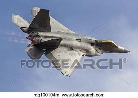 A U. S. Air Force F-22 Raptor makes a fast flyby. View Large Photo Image Picture - A U. S. Air Force F-22 Raptor makes a fast flyby.. Fotosearch