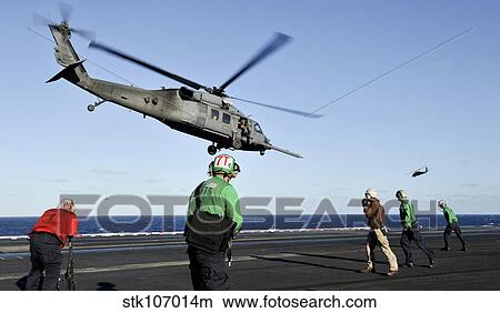 A U. S. Air Force HH-60G Pave Hawk helicopter lifts off from USS Nimitz. View Large Photo Image Picture - A U. S. Air Force HH-60G Pave Hawk helicopter lifts off from USS Nimitz.. Fotosearch