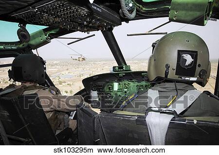 Picture - A U. S. Air Force instructor pilot instructs an Iraqi student.. Fotosearch