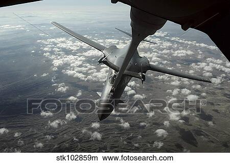 A U. S. Air Force KC-10 refuels a B-1B Lancer over Afghanistan. View Large Photo Image Picture - A U. S. Air Force KC-10 refuels a B-1B Lancer over Afghanistan.. Fotosearch